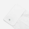 vintage small white cufflinks 1950s white Lucite cufflink with pearlized button design fastened on a white French cuff shirt.