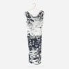 Escada splash-print jersey dress displayed on a pearl-trimmed hanger.