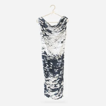 Escada splash-print jersey dress displayed on a pearl-trimmed hanger.