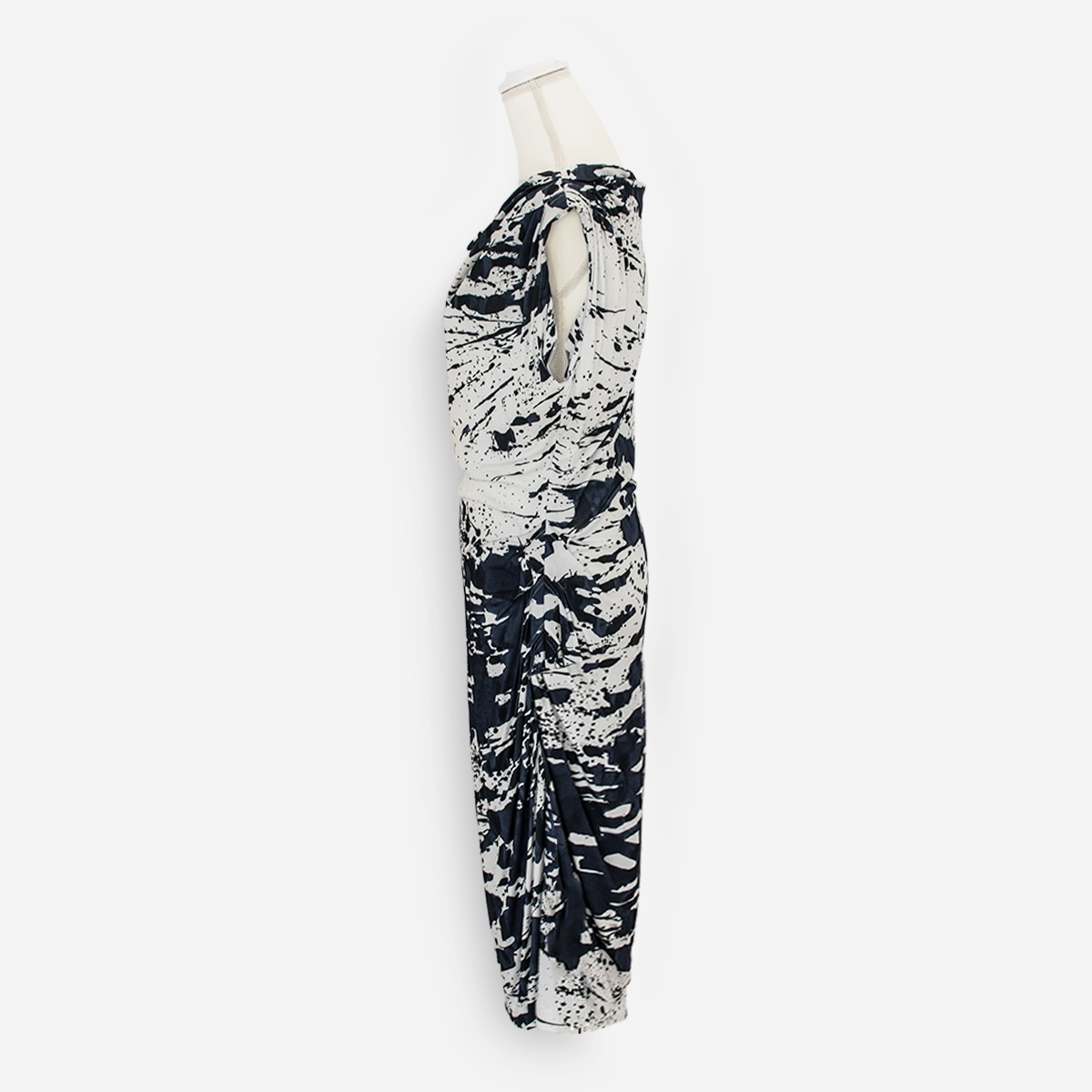 Opposite side view of the Escada dress showing the sleeveless neckline and asymmetric skirt draping.