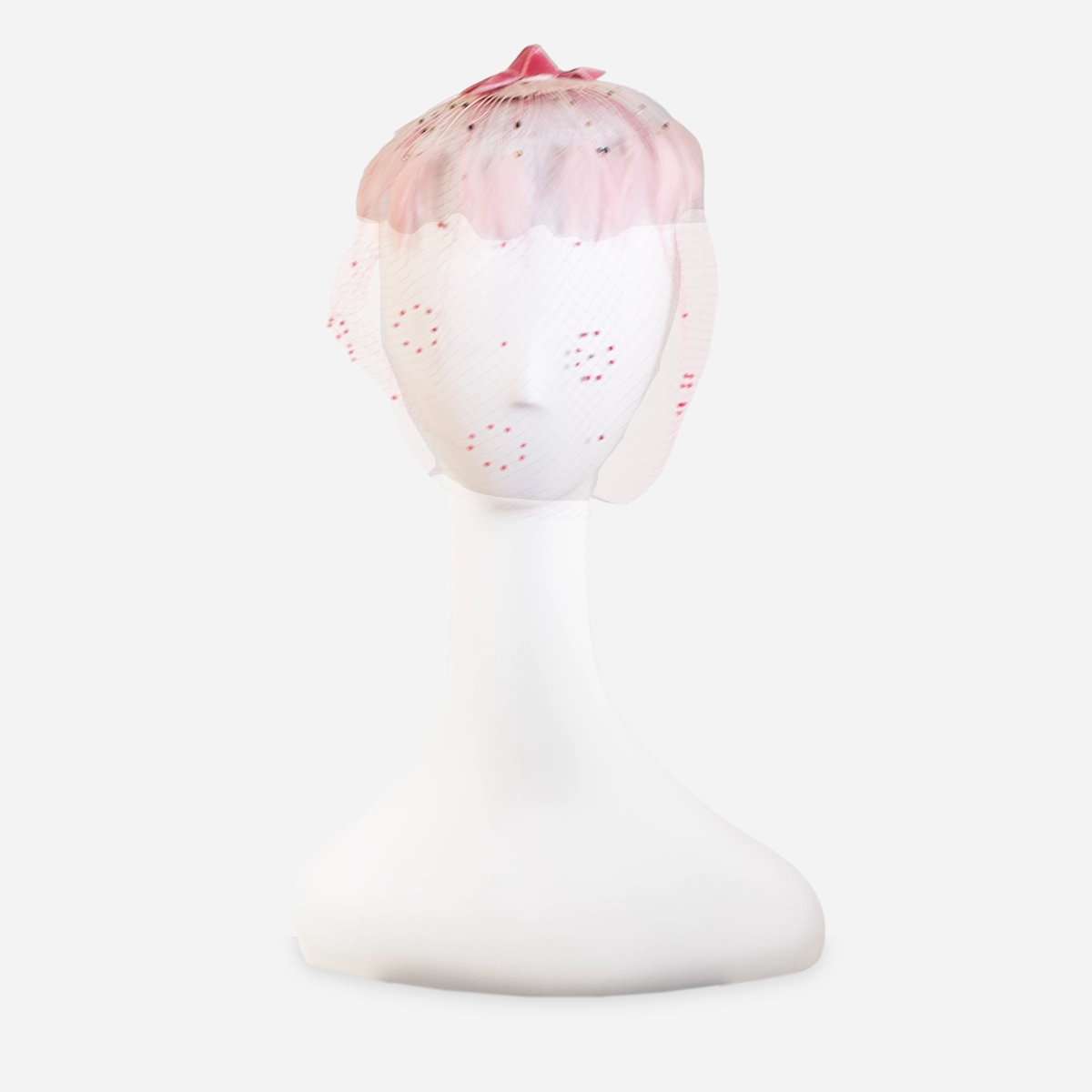 Front detail of pink whimsy hat with feather fringe, bead accents and velvet bow