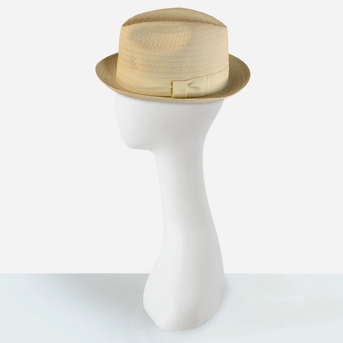 vintage crushable nylon trilby Three-quarter view of cream Cosmopolitan trilby showing narrow brim and tonal ribbon band.